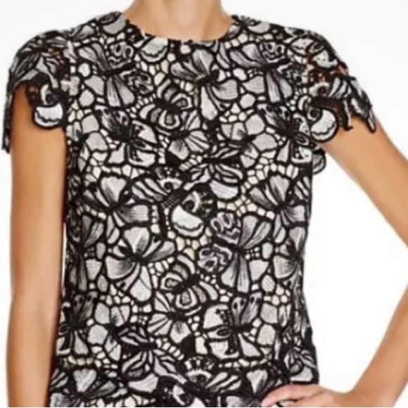 Alice + Olivia black and white flower lace top over a nude lining. - Picture 1 of 12